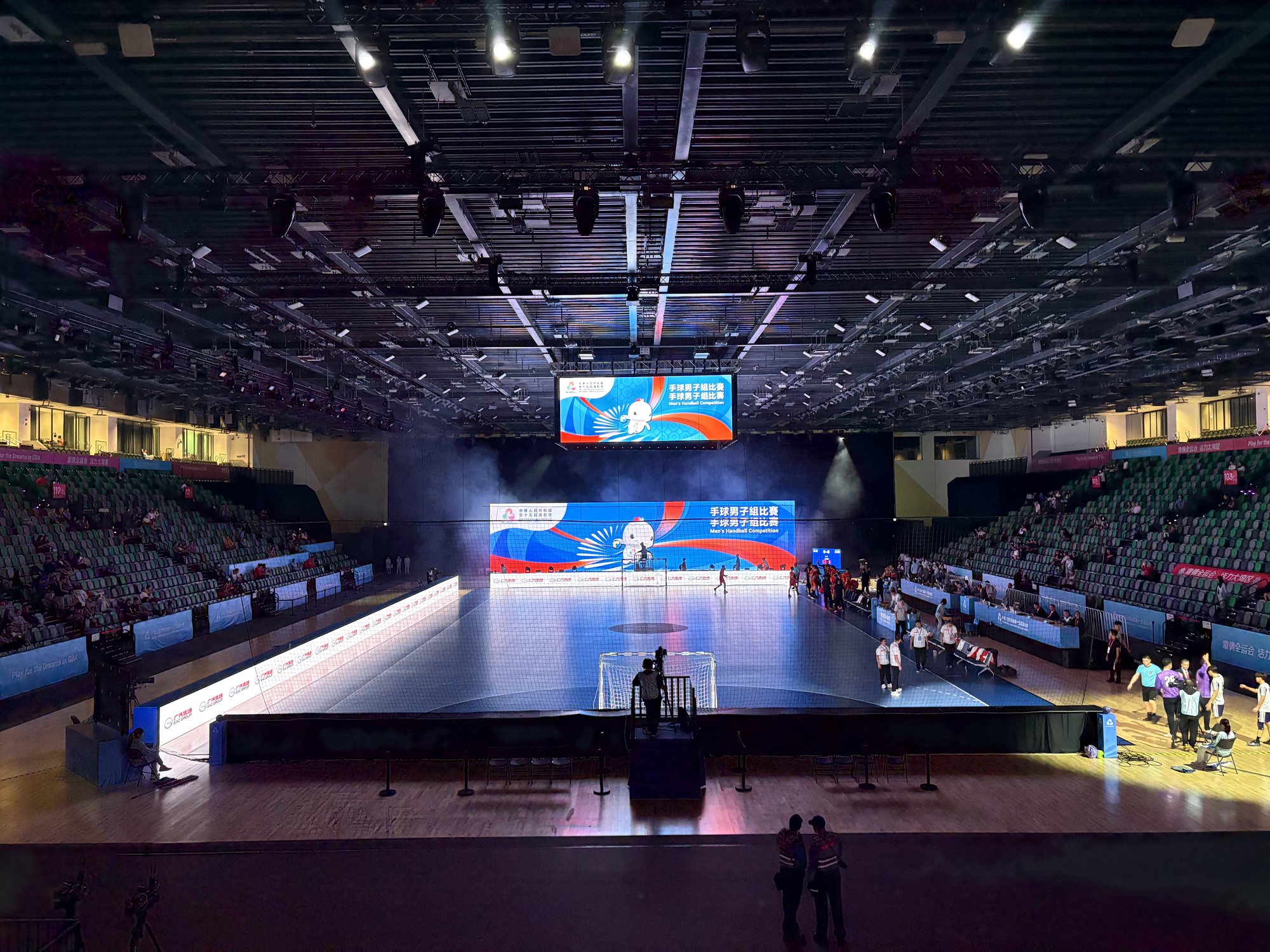 Men's handball at the 15th National Games, 2025, with broadcast cameras along the court