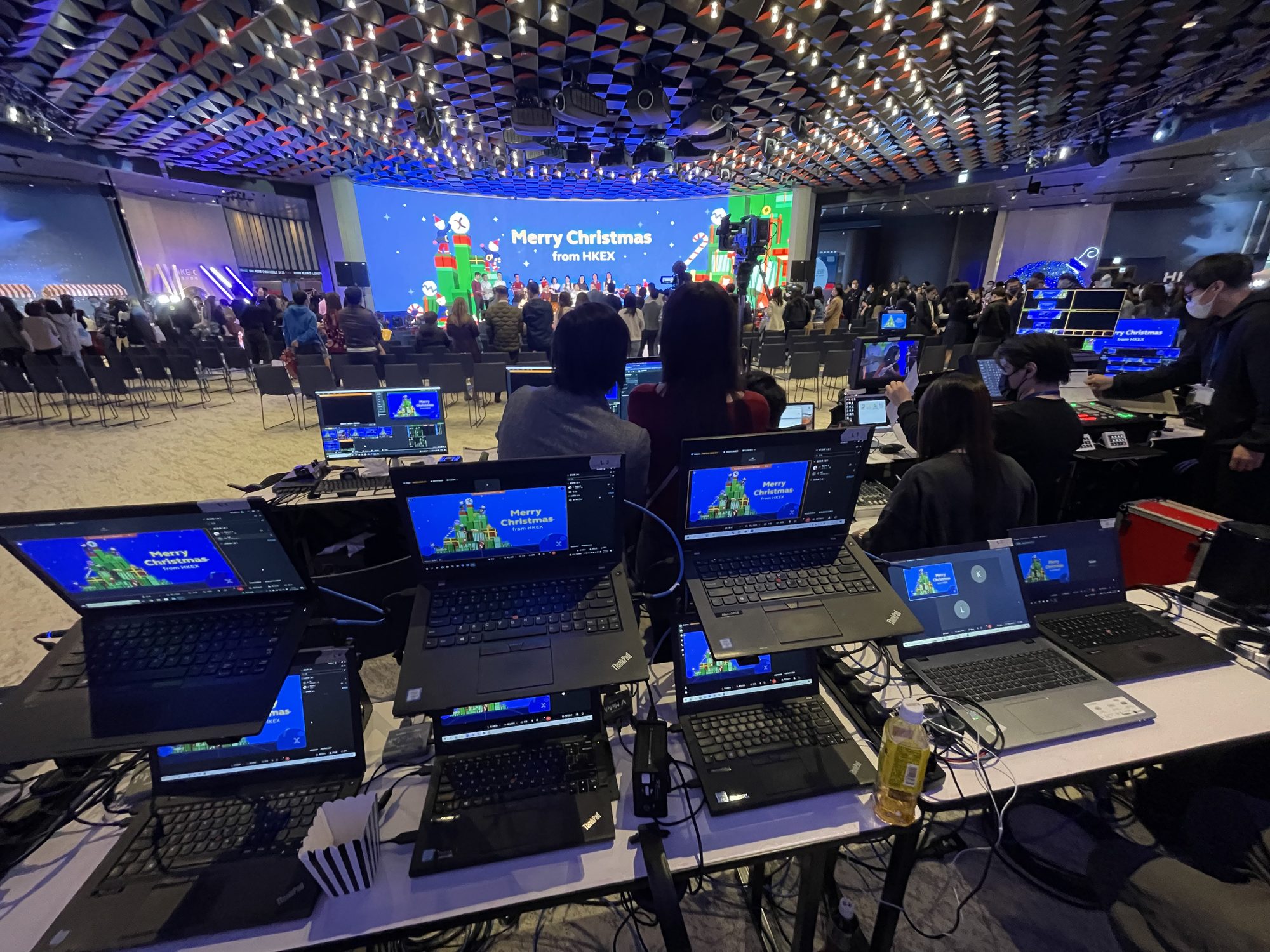 Gallery laptops and cameras covering a Merry Christmas from HKEX event